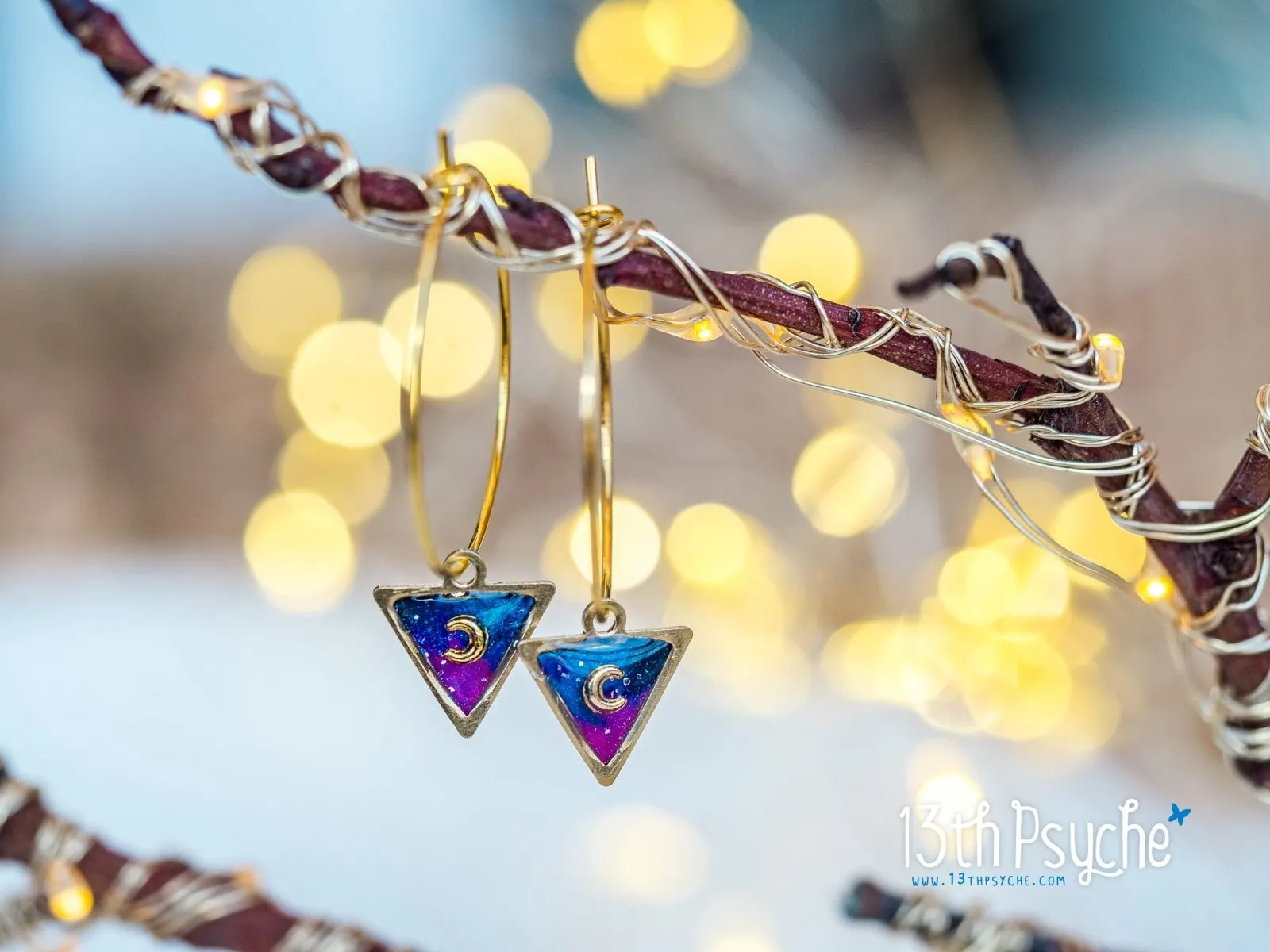 Hypoallergenic gold hoop earrings with triangle shape galaxy inspired charm