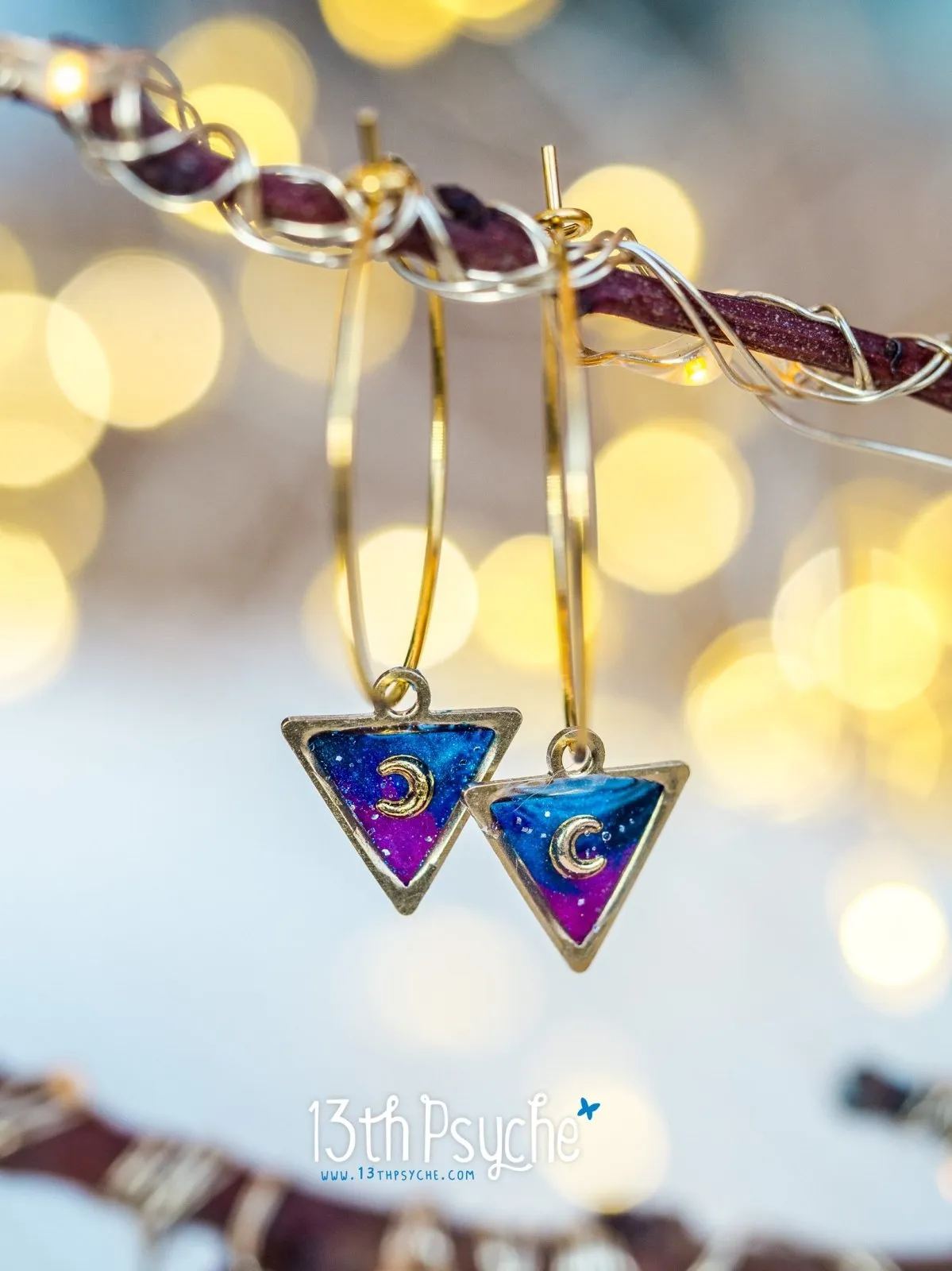 Hypoallergenic gold hoop earrings with triangle shape galaxy inspired charm